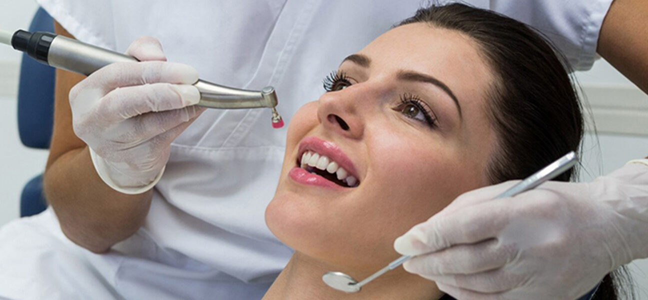 dentist doing fillings in girl mouth dental equipment